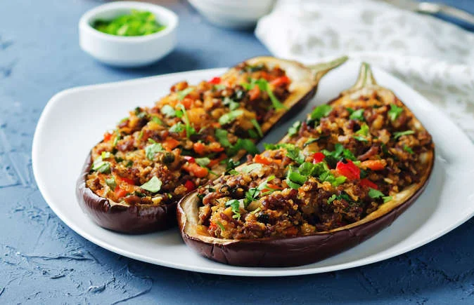 Lamb-stuffed eggplants with manchego