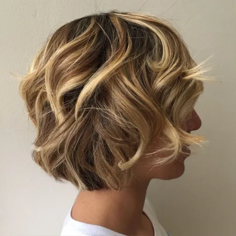 12. Curly Bob with Highlights