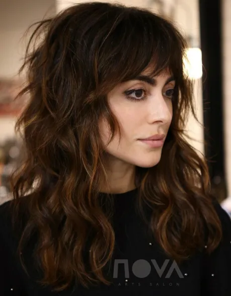 8. Warm-Toned Wavy Brunette Shag Hairstyle