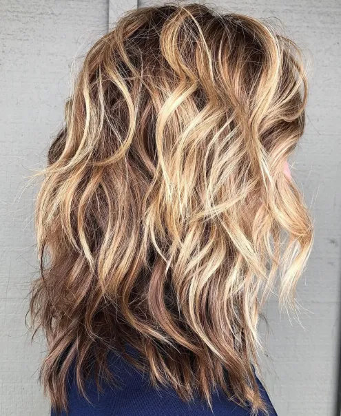 Shoulder-Length Wavy Layered Hair with Highlights