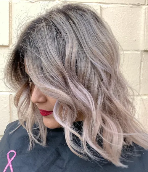 10. Icy Platinum Locks with Dark Roots
