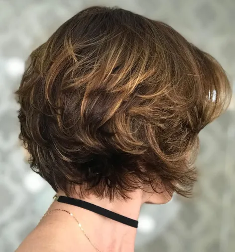 2. Short Feathered Haircut with Highlights
