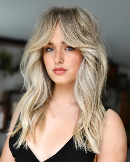 12. Wavy Hair with Long Curtain Bangs
