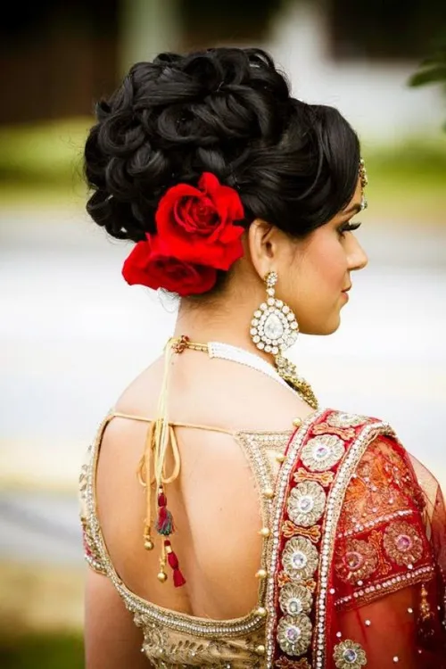 10. Heavenly Curly Updo with Hair Flowers
