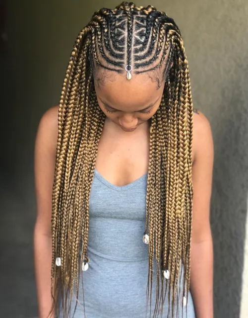 11. Artistic Fulani Braid Crown with Shell Adornments
