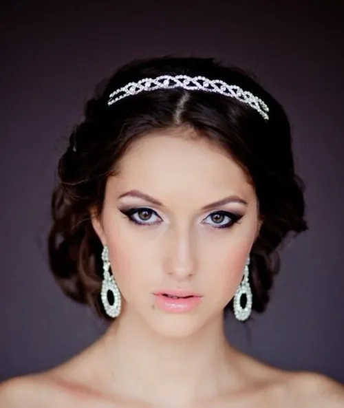 13. Low Curly Updo with a Jeweled Headband
