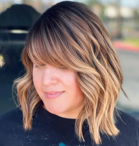 3. Wavy Bob with Thick Bangs
