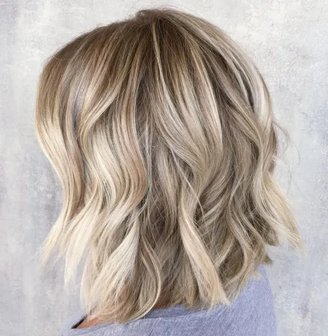 13. Feathered and Tousled Wavy Bob