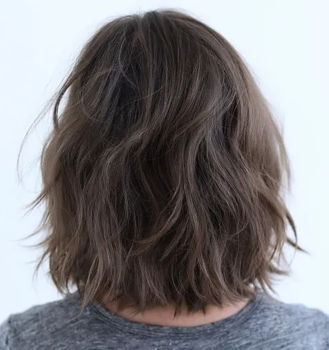 9. Brunette Bob with Feathered Layers
