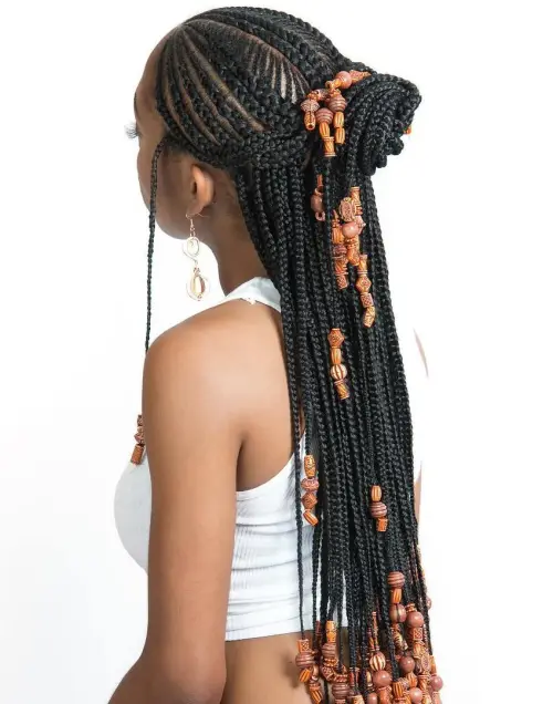 4. Cornrows with Artistic Beaded Twisted Bun
