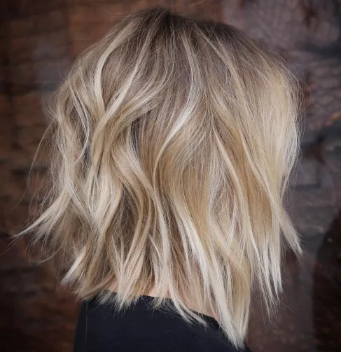 14. Chopped Tousled Honey Blonde Lob
