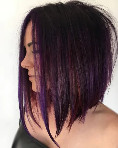 8. Angled Brunette Bob with Purple Highlights
