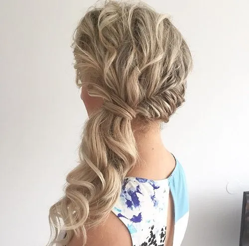 6. Side-Swept Curly Ponytail
