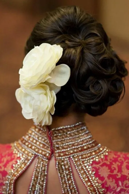 7. The Best Glamorous Curly Updo with Large Flowers
