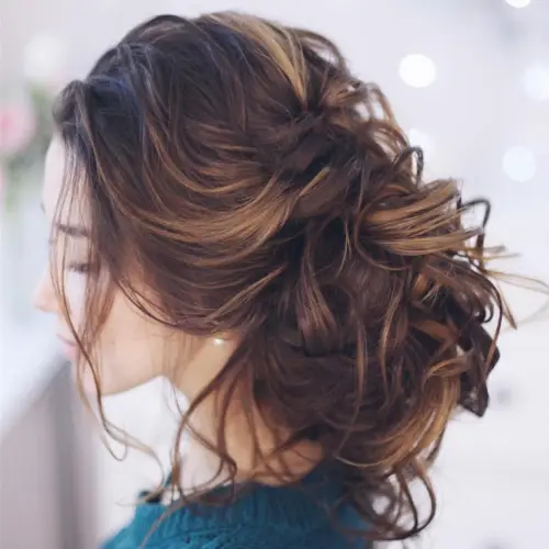 14. Messy and Curly Loose Updo
