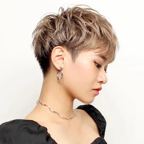 10. Modern Dark Blonde Layered Pixie
