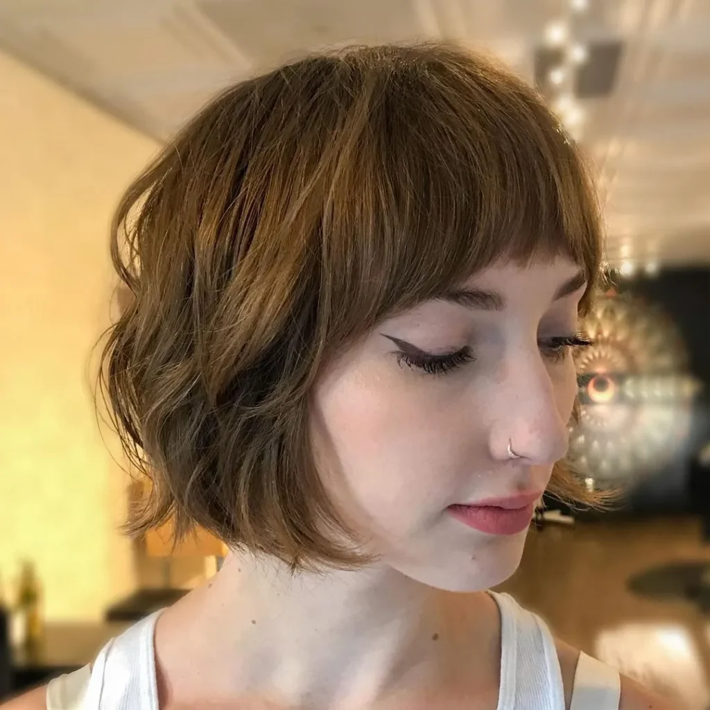 15. Textured with Curved Bangs
