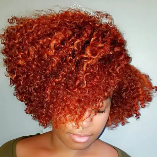 11. Edgy Red Bob with Deep Side Part
