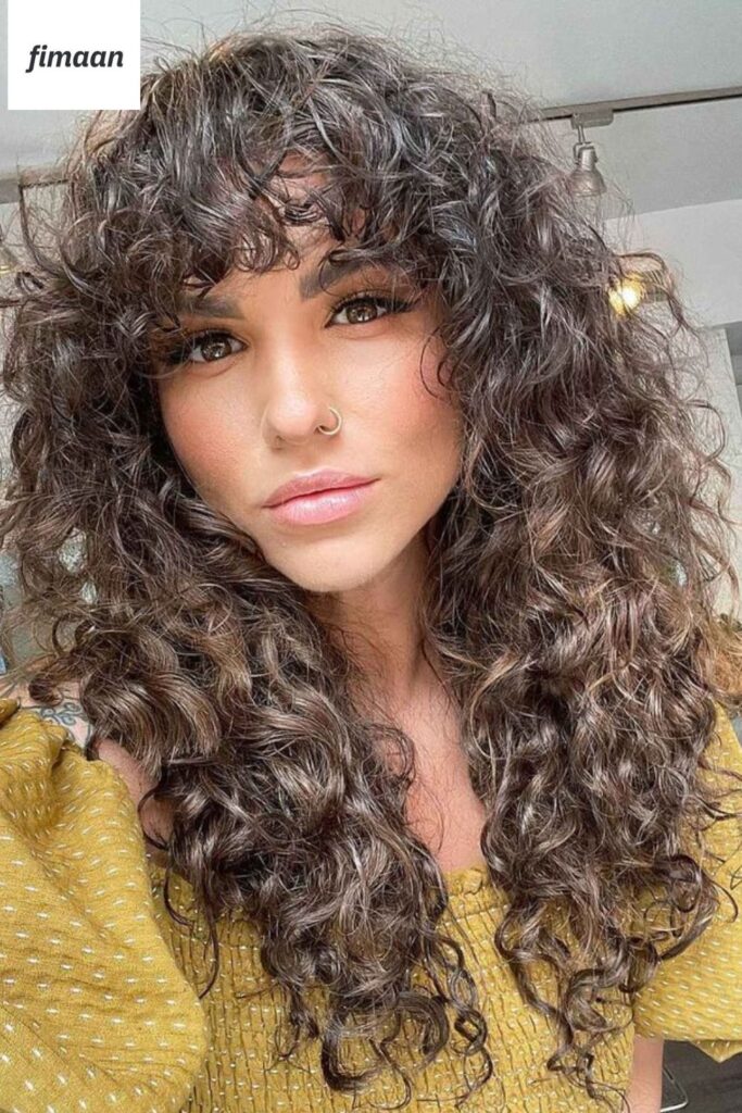 2. Sassy Curly Shag with Bangs